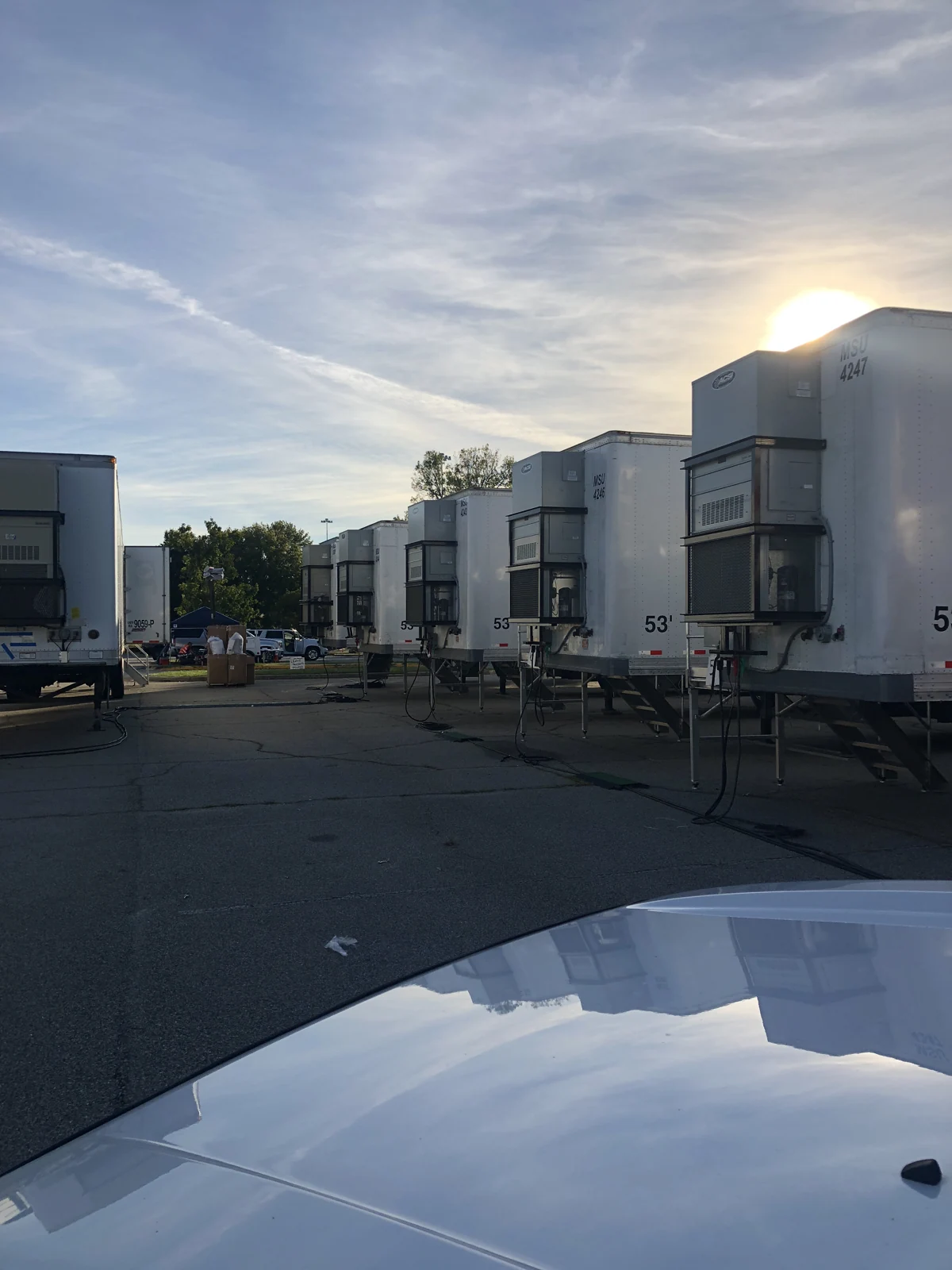 Rows of support trailers with individual climate-control units in the 2018 archive