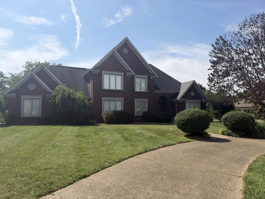 Original photograph of a Kentucky brick home documented for residential and landscape improvement planning